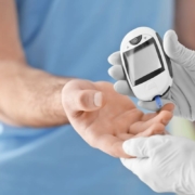 man getting his blood sugar checked by a diabetes program specialists