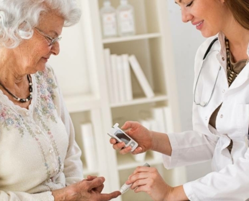 senior citizen getting diabetes care from healthcare professional